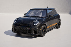 The 1998 GT Edition in Midnight Black Metallic with orange lower-body graphics and JCW aero | Image: MINI