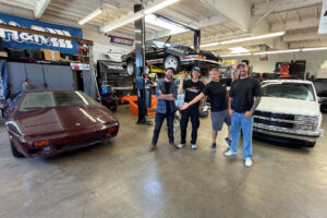 Mike Burroughs, Vin Anatra, and Larry Chen with their RADwood Build Challenge project cars | Image: Hagerty